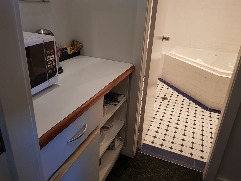 Family Room, Multiple Beds, Jetted Tub | Private kitchenette | Microwave, electric kettle