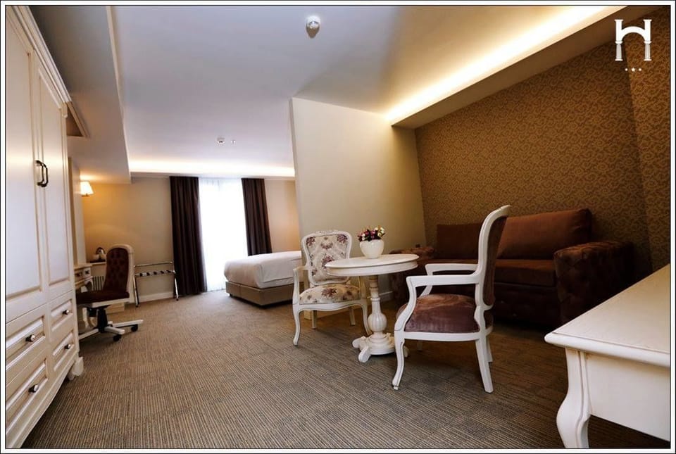 Family Suite, Sea View | Living area | LCD TV