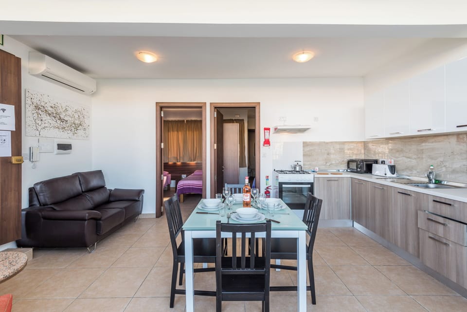 Panoramic Apartment, Sea View | Living area | 32-inch LED TV with satellite channels, TV