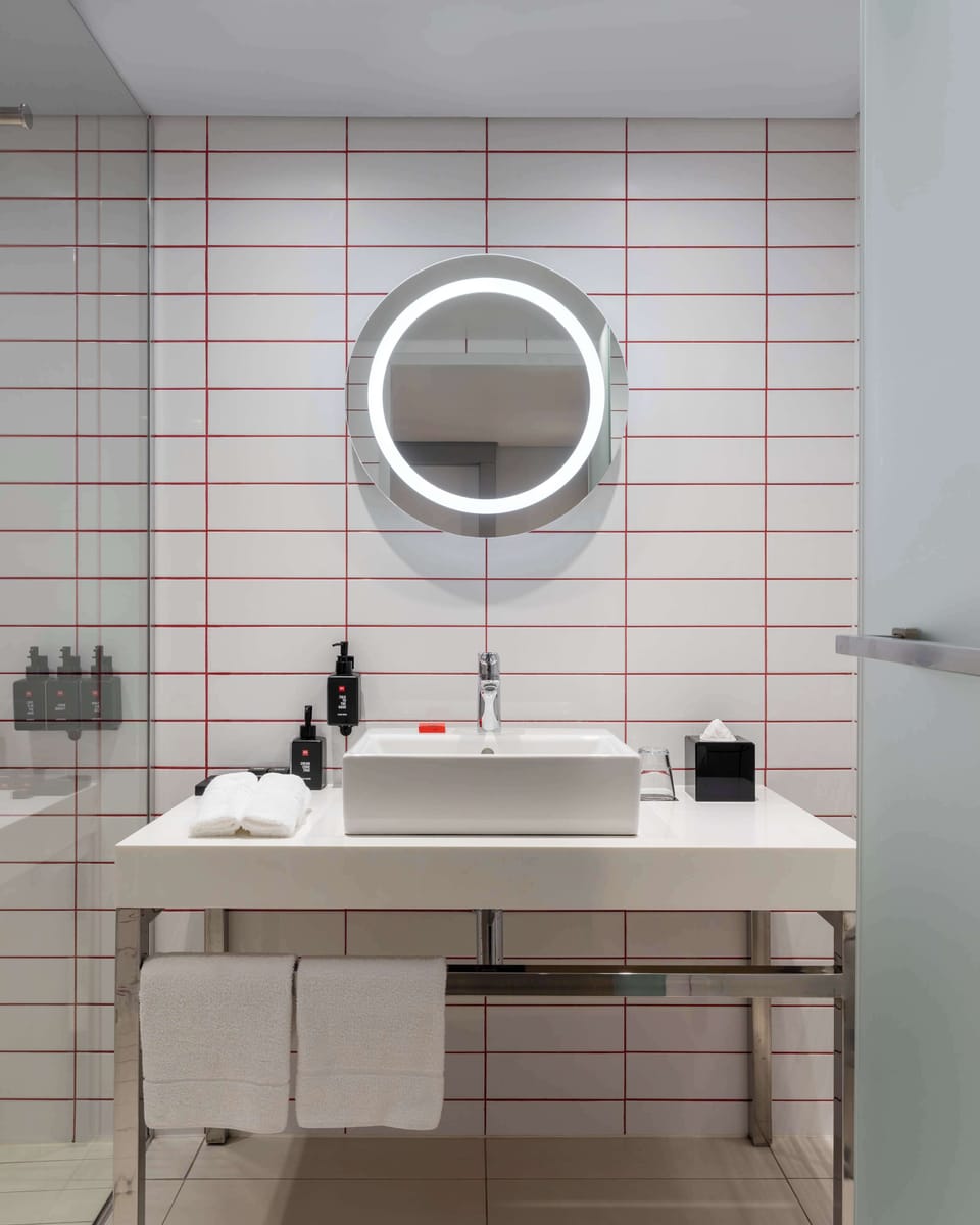 Family Room (Table Mountain View) | Bathroom | Shower, eco-friendly toiletries, towels