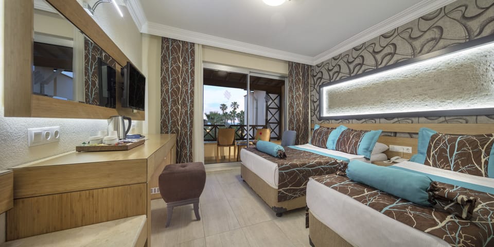Villa Family Room | Free minibar, in-room safe, desk, bed sheets