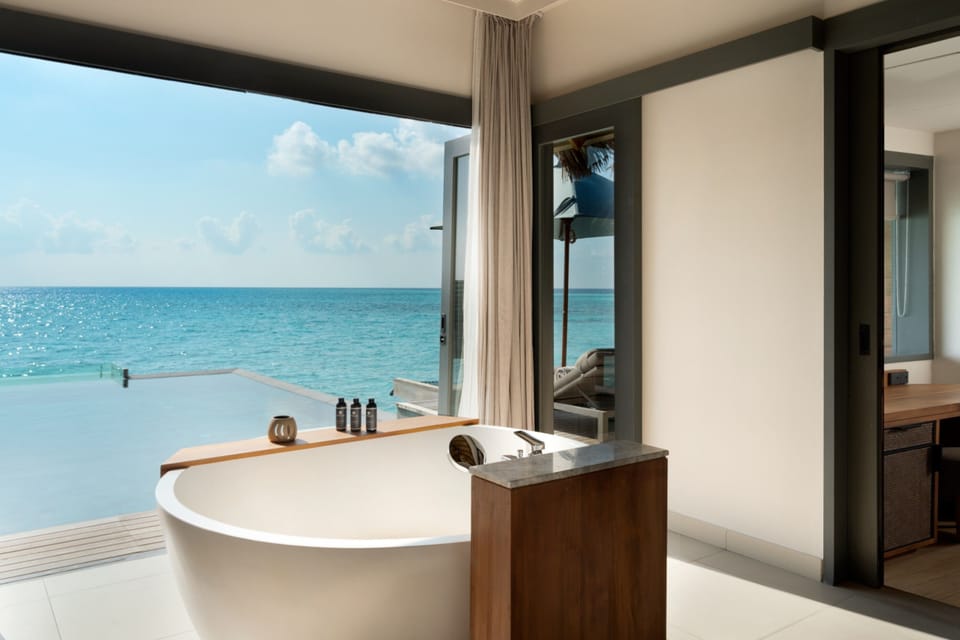 One Bedroom Over Water Pool Residence | Bathroom | Separate tub and shower, rainfall showerhead, free toiletries
