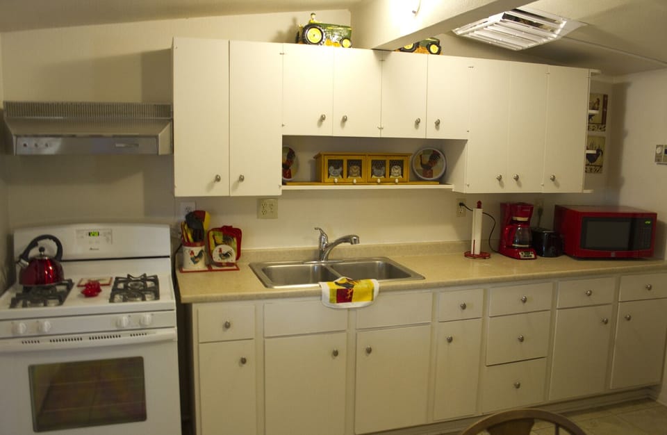 We have pots, pans, a blender, waffle maker, mixer, and dishes in cupboards.
