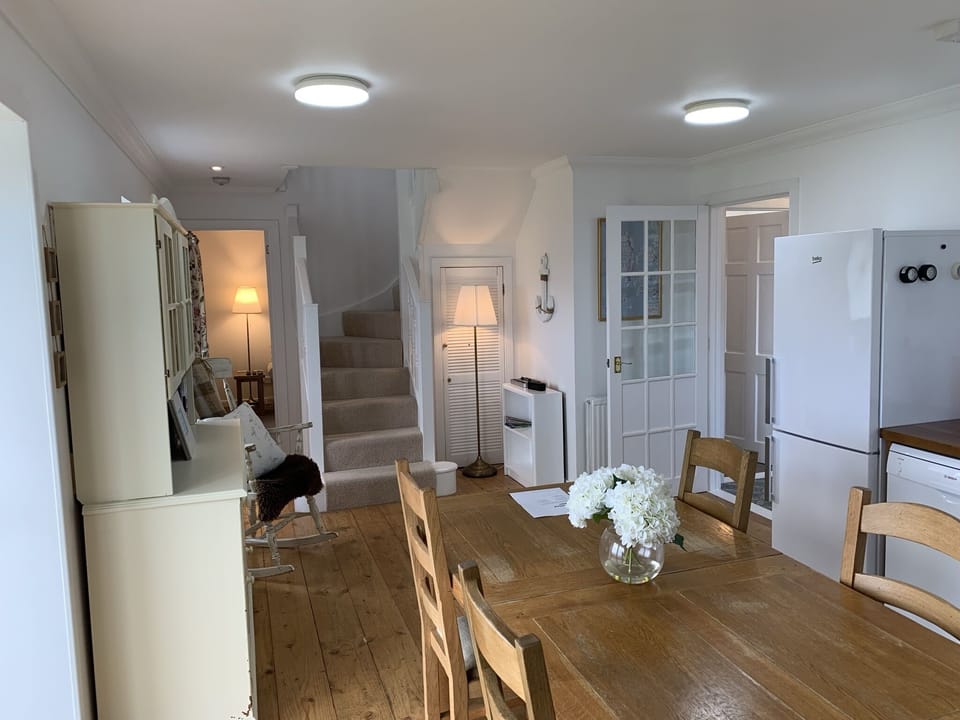 Kitchen leading to living room and upstairs bedrooms