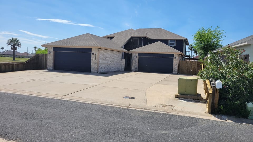 Spacious driveway for vehicles and boat trailers!