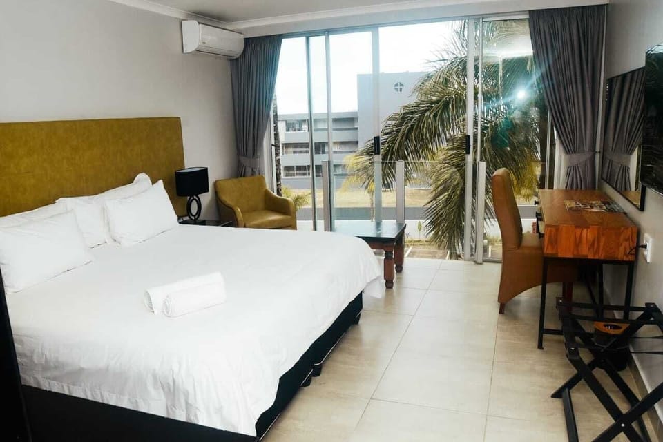 Standard Room, Balcony | Desk, laptop workspace, blackout drapes, iron/ironing board