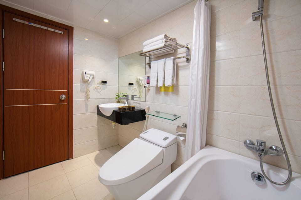 Family Room, City View | Bathroom | Free toiletries, hair dryer, bathrobes, slippers