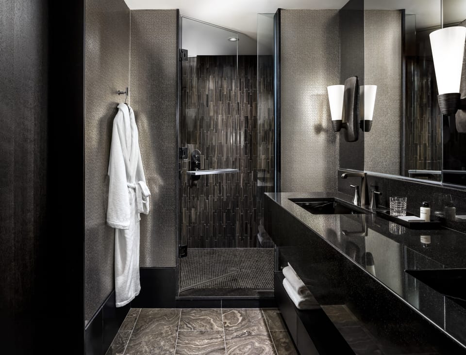 Shower, designer toiletries, hair dryer, bathrobes