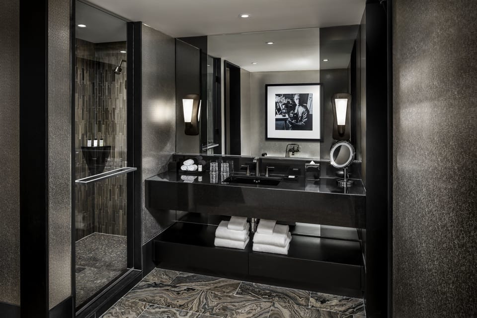 Shower, designer toiletries, hair dryer, bathrobes