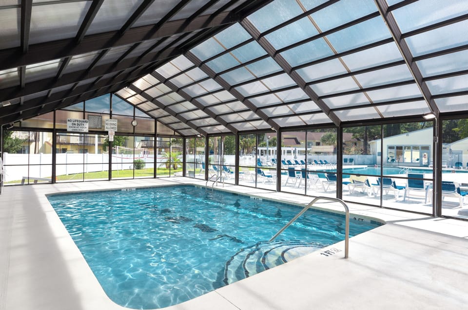 Indoor pool, outdoor pool, pool umbrellas, sun loungers