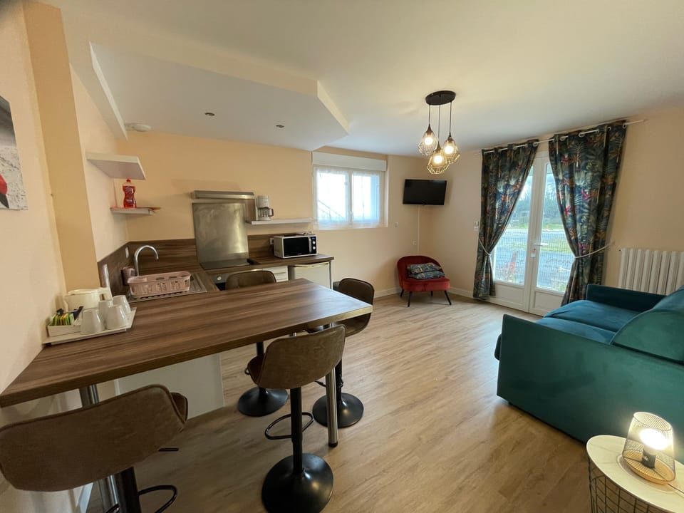 Comfort Apartment, Kitchen, Partial Sea View | Living area | Flat-screen TV
