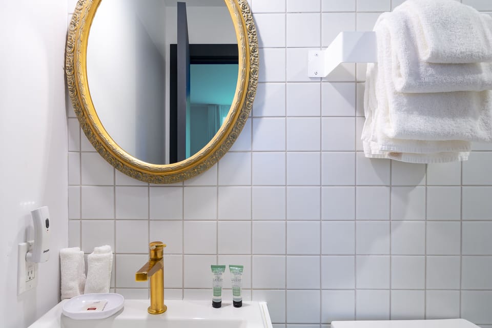 Room, 2 Queen Beds | Bathroom | Shower, rainfall showerhead, free toiletries, hair dryer
