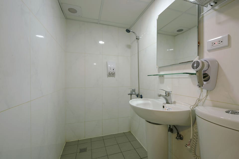 Shower, free toiletries, hair dryer, slippers