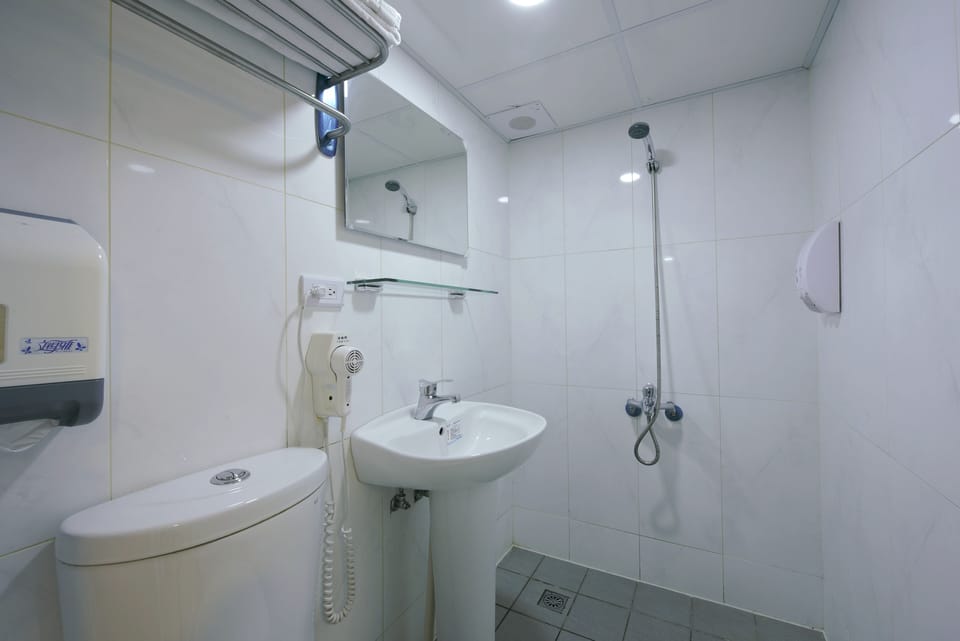 Shower, free toiletries, hair dryer, slippers