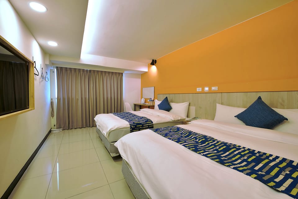 Standard Quadruple Room, City View | Desk, blackout drapes, iron/ironing board, free WiFi