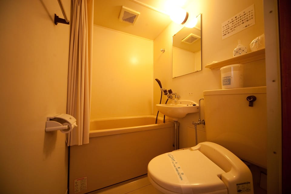 Single Room | Bathroom | Hair dryer, slippers, towels, soap
