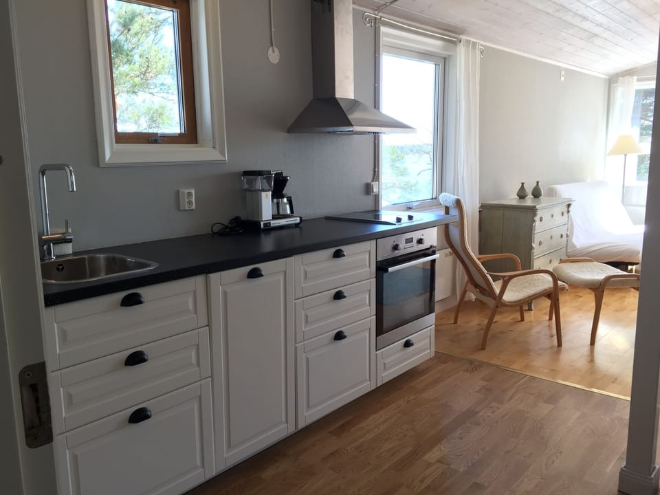 Deluxe Cottage, 1 Bedroom, Ocean View, Oceanfront | Private kitchen | Coffee/tea maker, fridge, stovetop, toaster