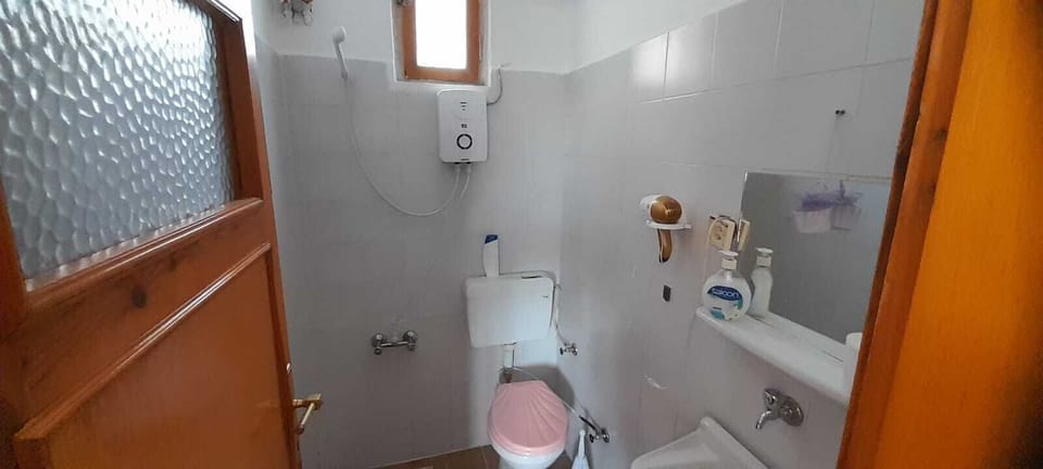 Quadruple Room | Bathroom | Slippers, towels