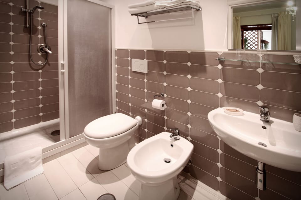 Double or Twin Room | Bathroom | Shower, free toiletries, hair dryer, bidet