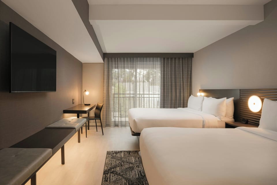 Premium bedding, down comforters, pillowtop beds, in-room safe