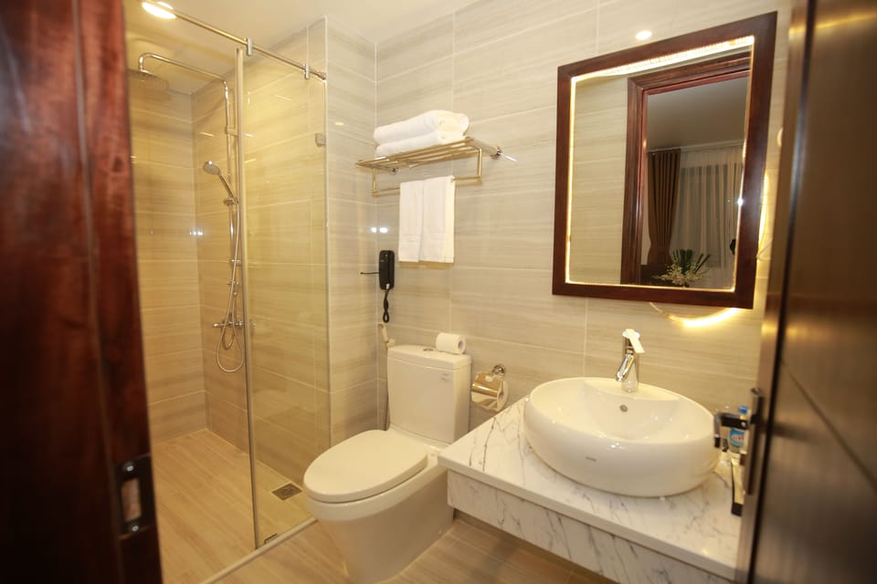 Shower, free toiletries, hair dryer, slippers