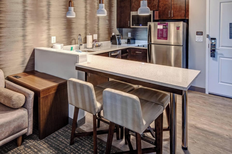 Studio, 2 Queen Beds | Private kitchen | Full-size fridge, microwave, stovetop, dishwasher