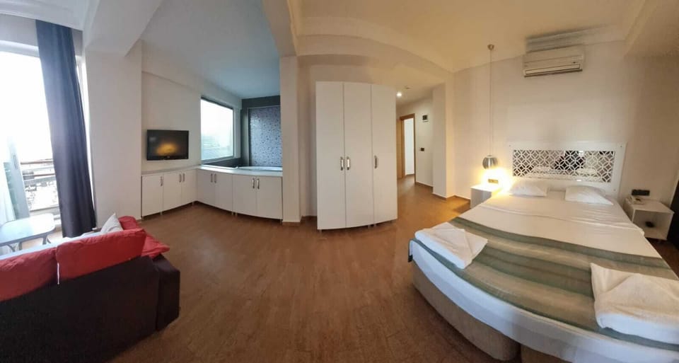 Minibar, laptop workspace, bed sheets