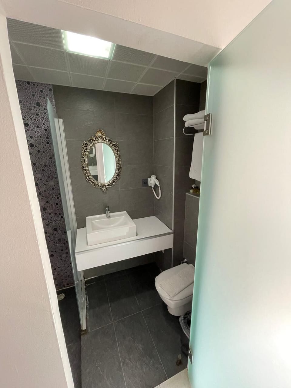 Shower, free toiletries, hair dryer, slippers