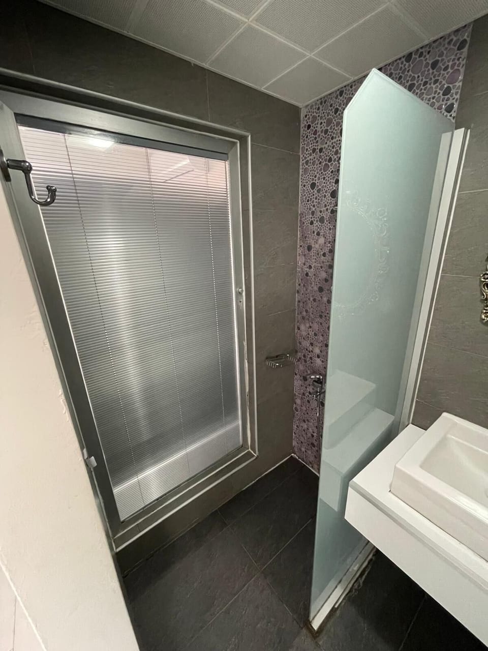 Shower, free toiletries, hair dryer, slippers