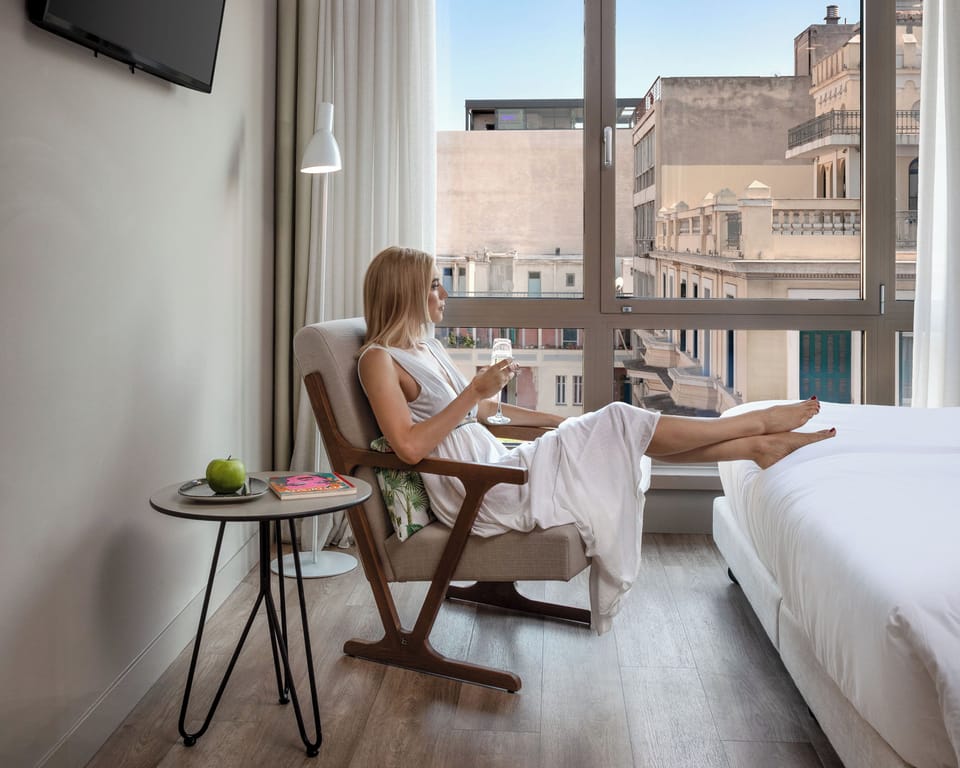 Superior Room, City View (Large King Room) | Minibar, in-room safe, desk, laptop workspace