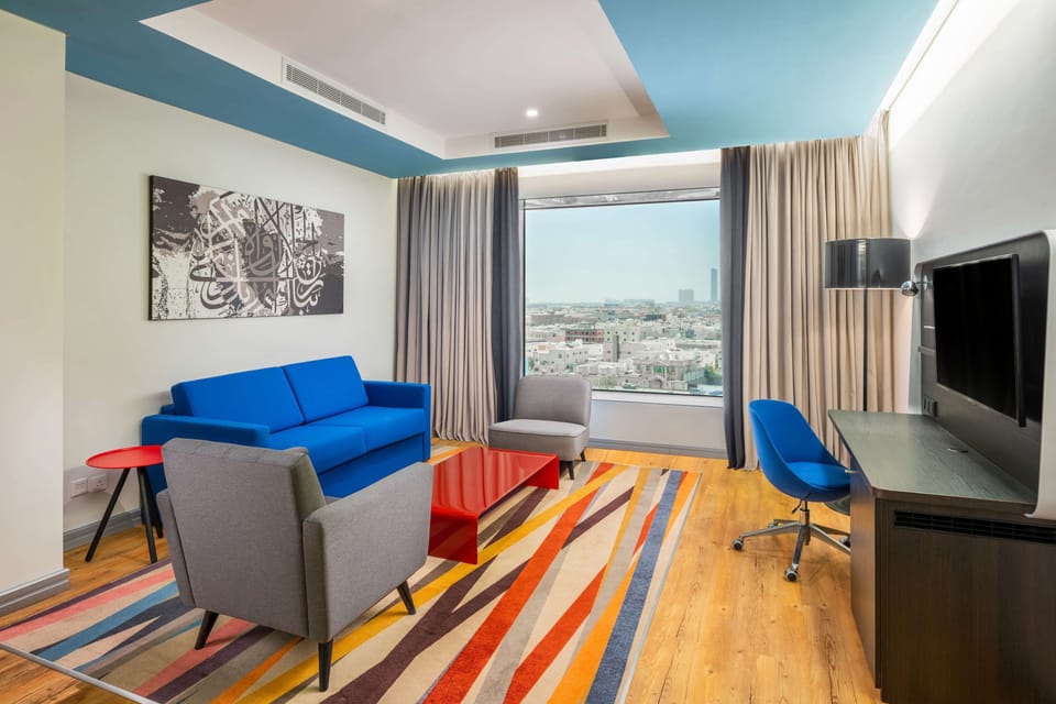 Premium bedding, down comforters, minibar, in-room safe