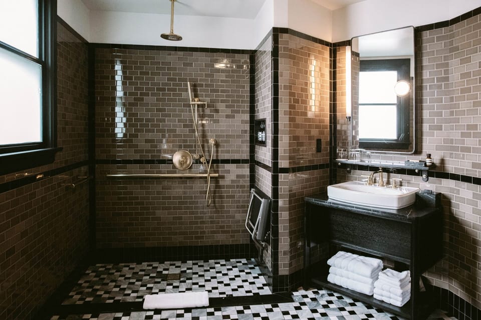 Shower, rainfall showerhead, designer toiletries, hair dryer