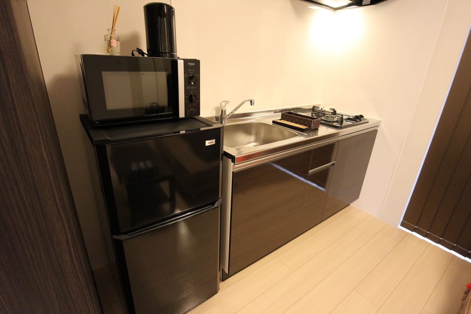 Studio, 3 Beds | Private kitchen | Full-size fridge, microwave, stovetop, electric kettle