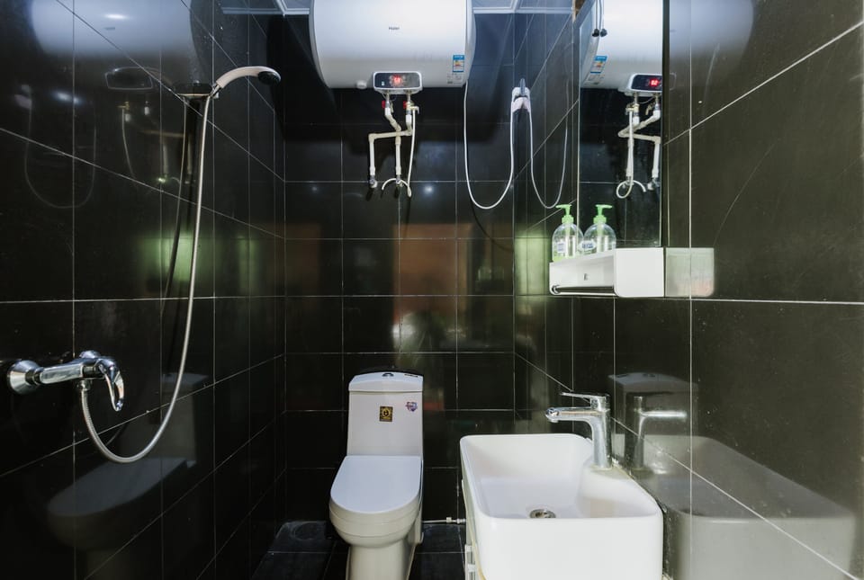 Shower, free toiletries, hair dryer, slippers