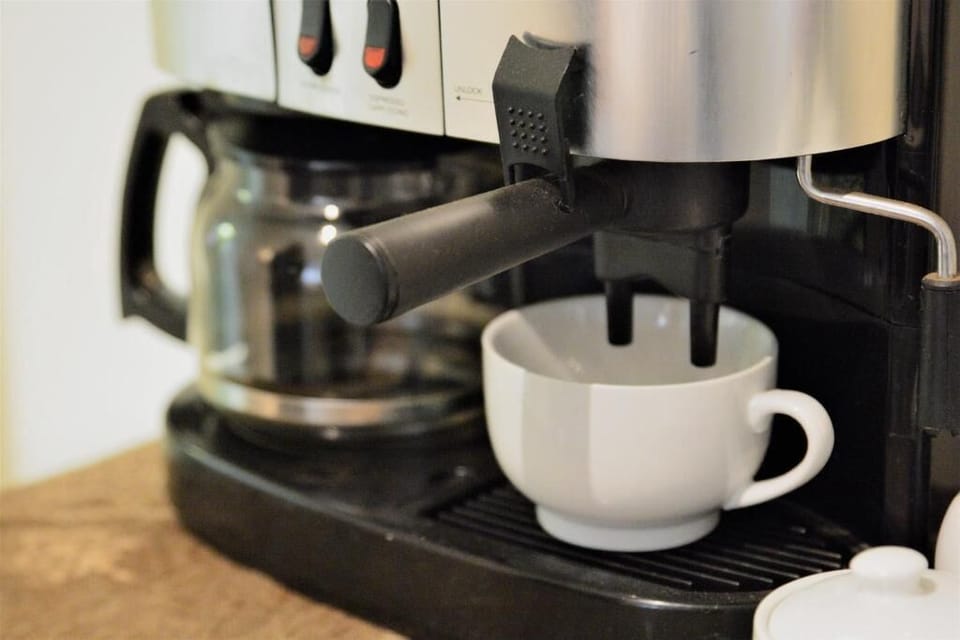 Coffee/tea maker, fridge, shared microwave, stovetop