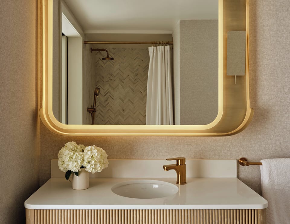 Combined shower/tub, designer toiletries, hair dryer, bathrobes