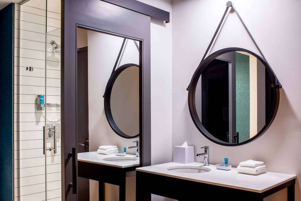 Shower, designer toiletries, hair dryer, towels