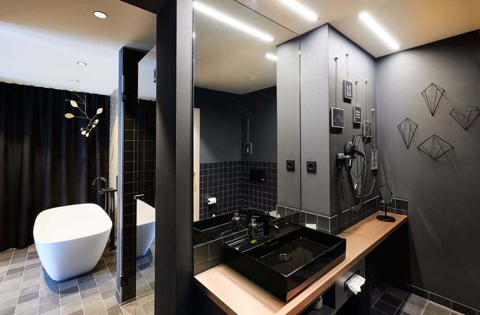 Suite | Bathroom | Hair dryer, bathrobes, towels, soap
