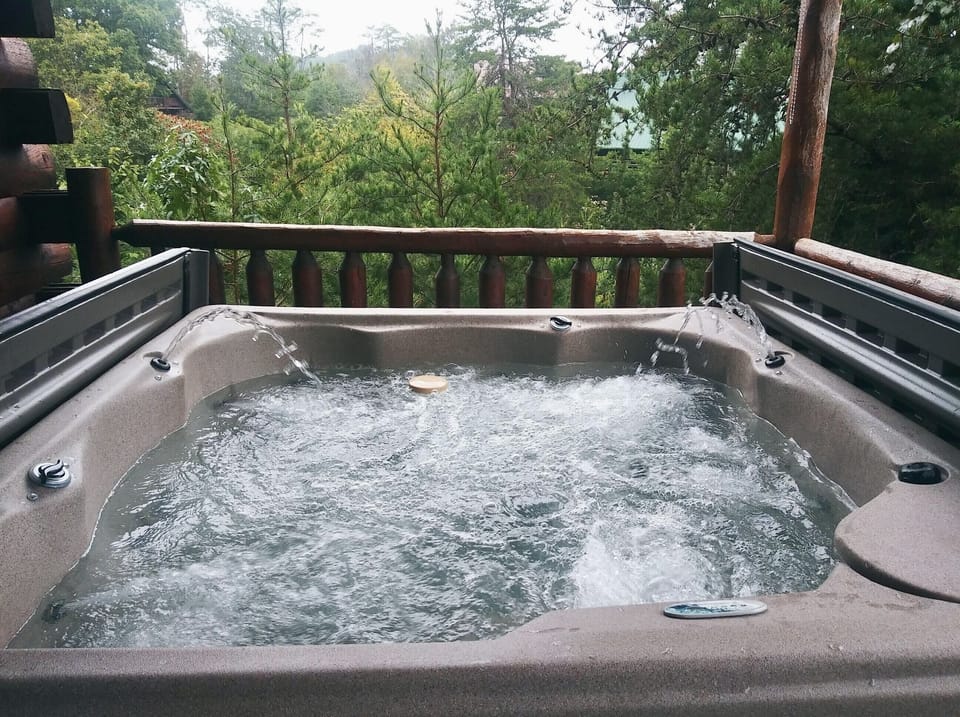 6 person hot tub with fountain spray on the main floor deck