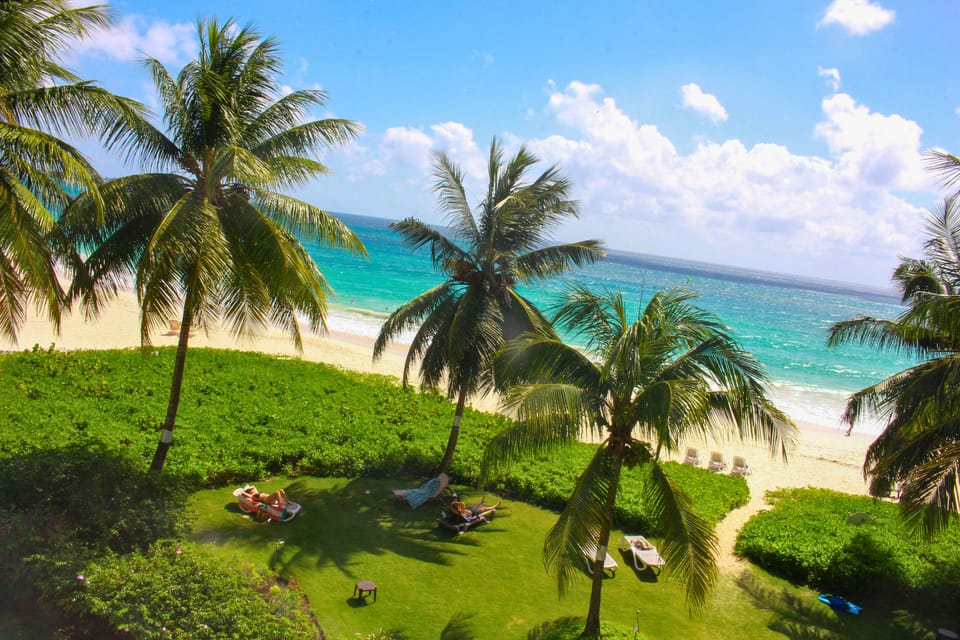 Pristine white sand just steps away from the property.