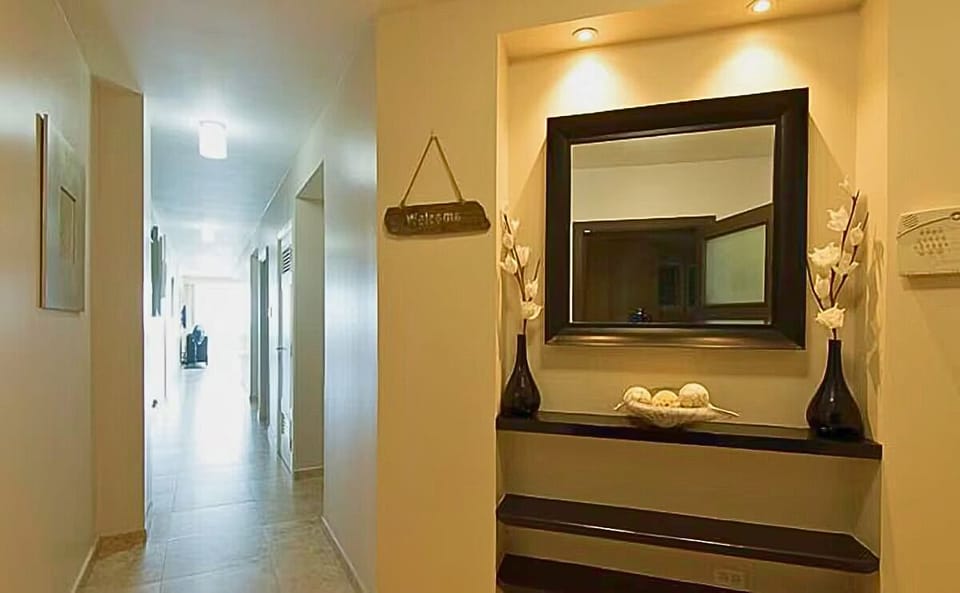 Inviting hallway with air-conditioning and a ceiling fan