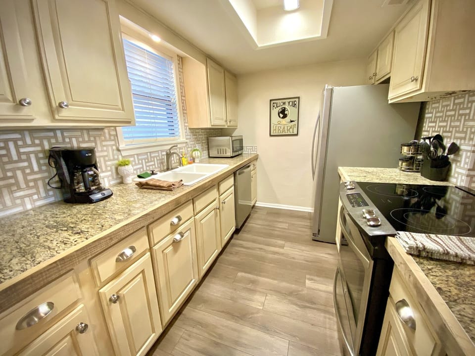 The kitchen is a great place for cooking or gathering for happy hour.