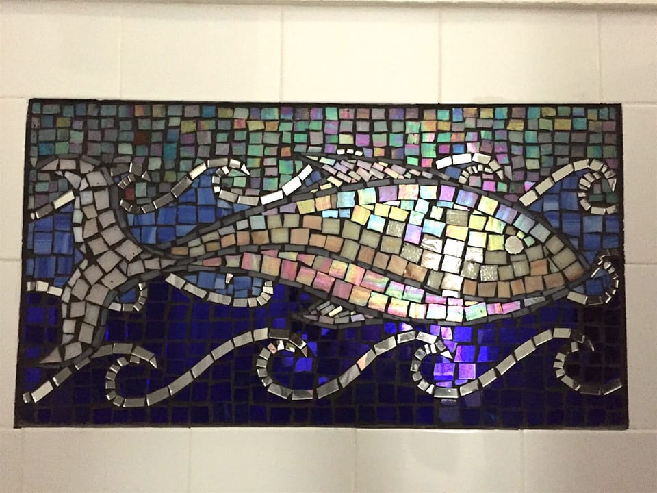 Bathroom has mosaics designed and installed by owner