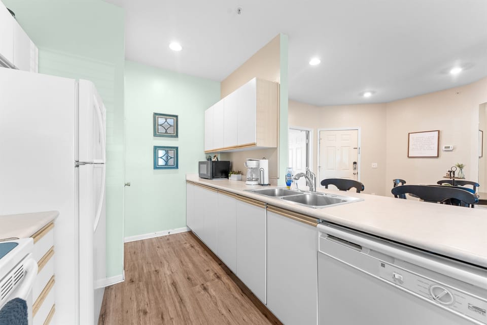 Another kitchen angle showing the full appliance setup and efficient galley layout.