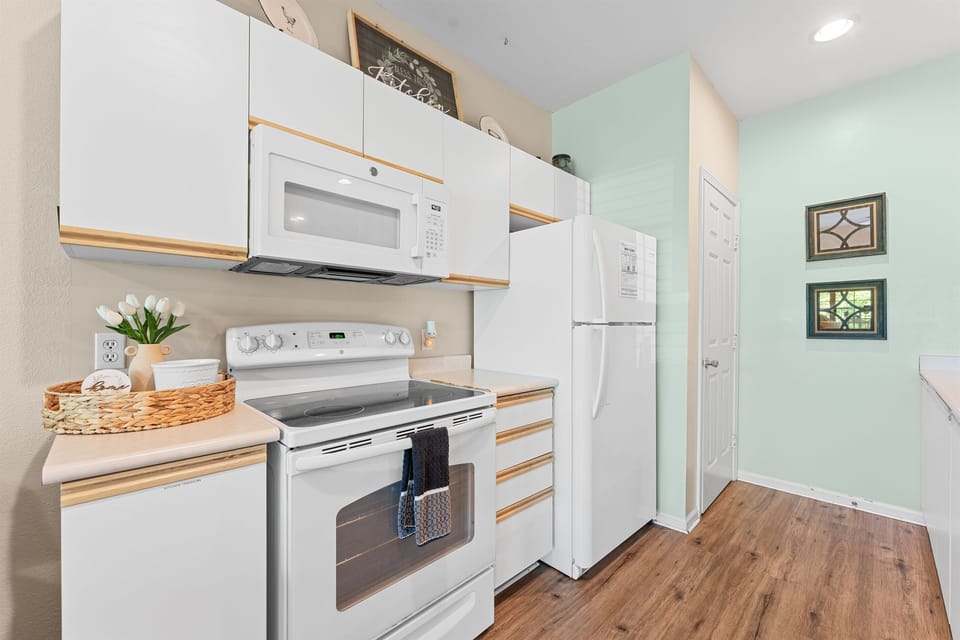 Fully equipped kitchen with full-size appliances and generous counter space for real meals, not just takeout.