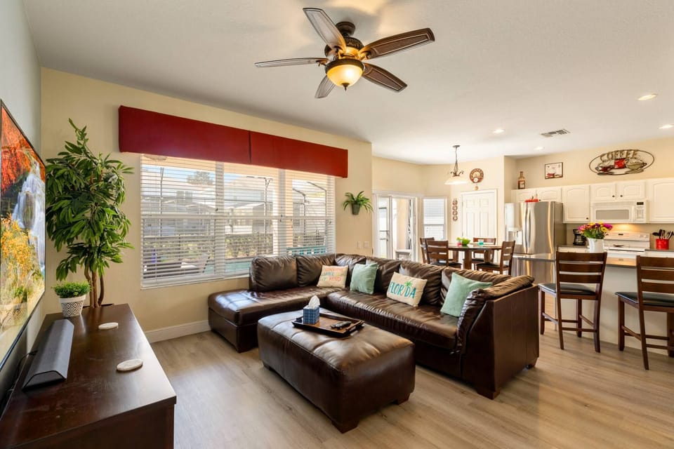 The open floor plan from the great room to the kitchen with views of the pool