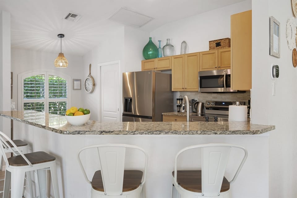 The island offers a perfect perch for breakfast, coffee, or conversation