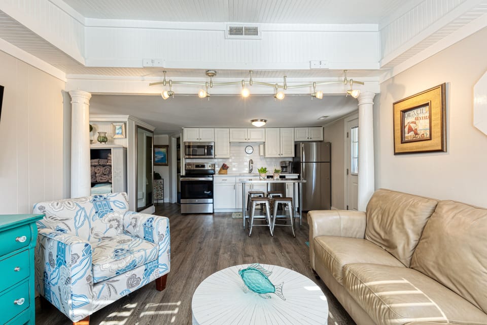 Every great living room needs a full kitchen steps away.