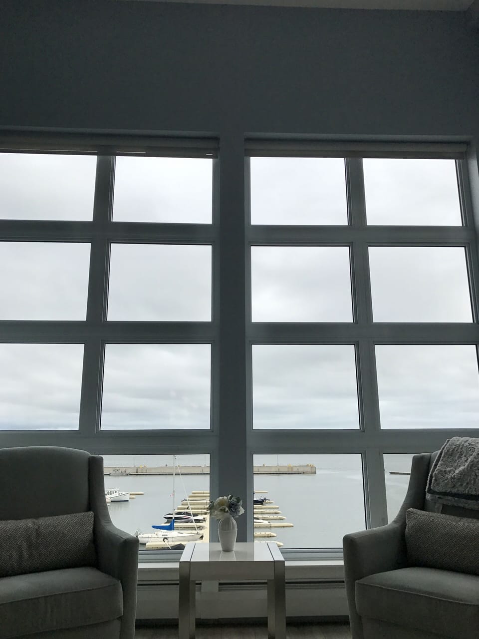 Vaulted high-ceiling with views over the cruise dock and marina.