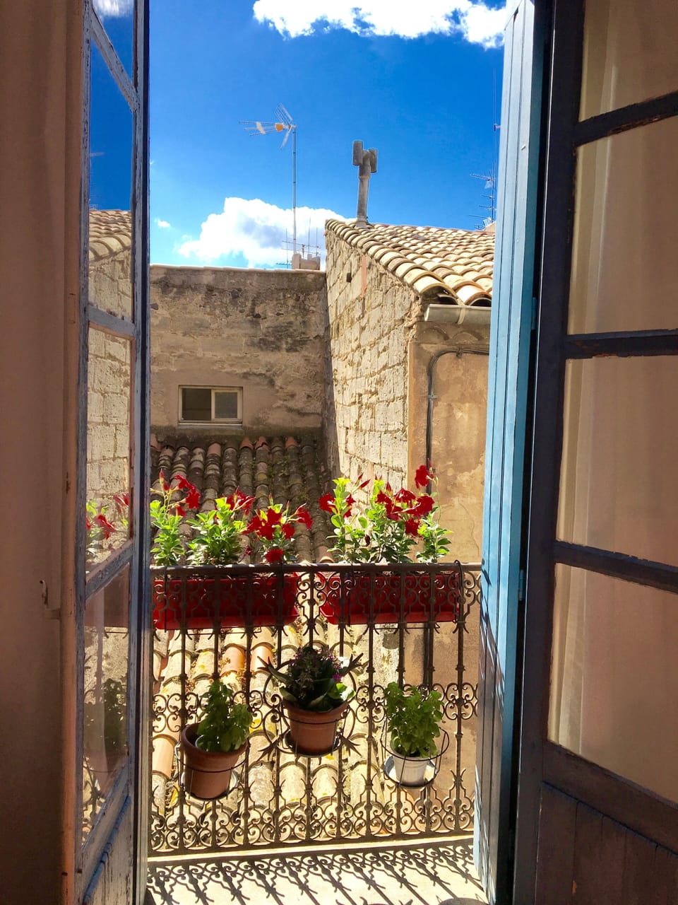 Beautiful mid-day light from the main Juliet Balcony of the rooftops.
